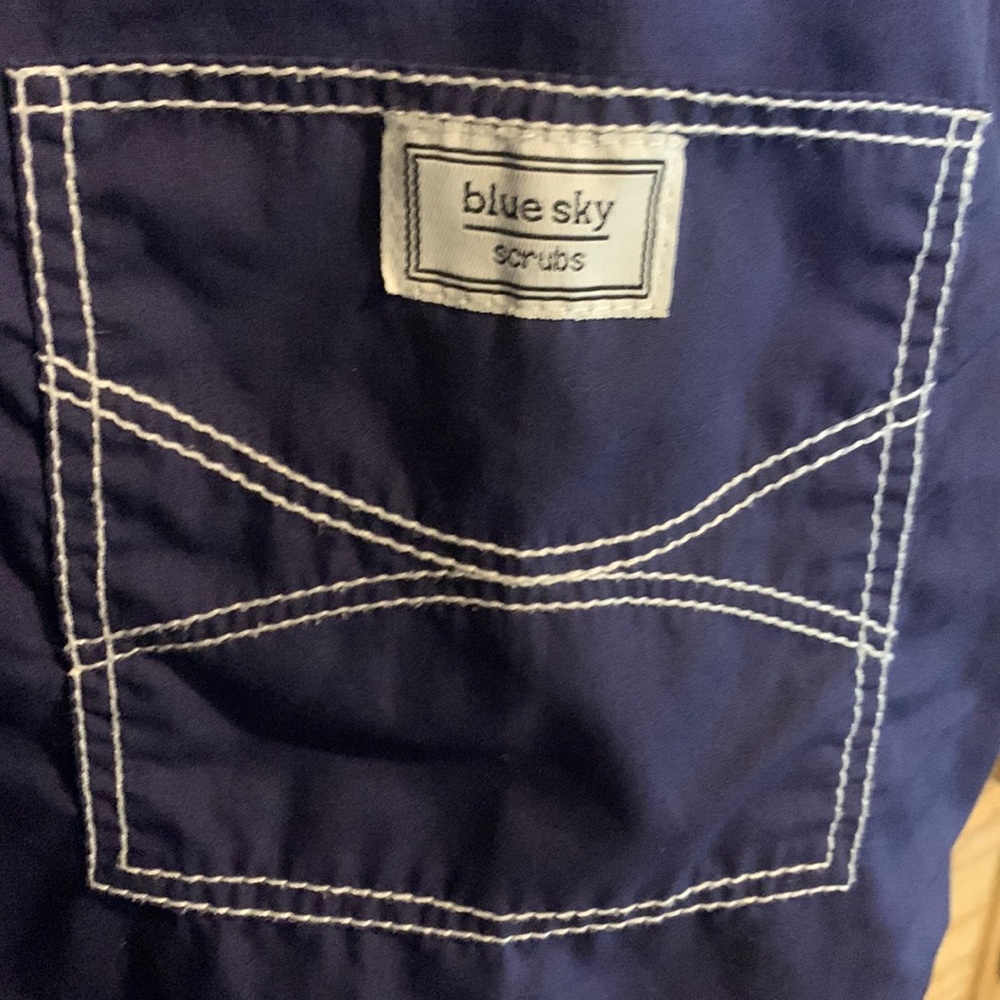 Blue sky scrub top with Jean pocket detail